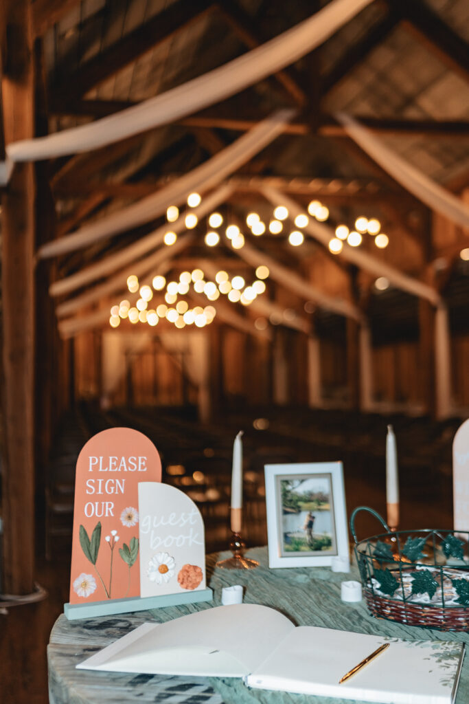 Entrance table and signs at the barn wedding