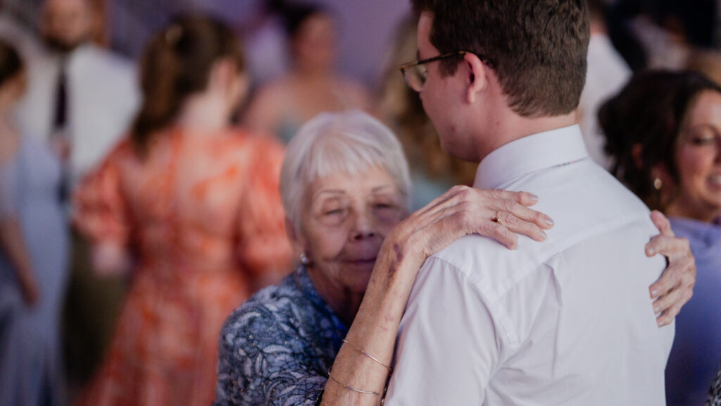 Grandmother dancing with groom