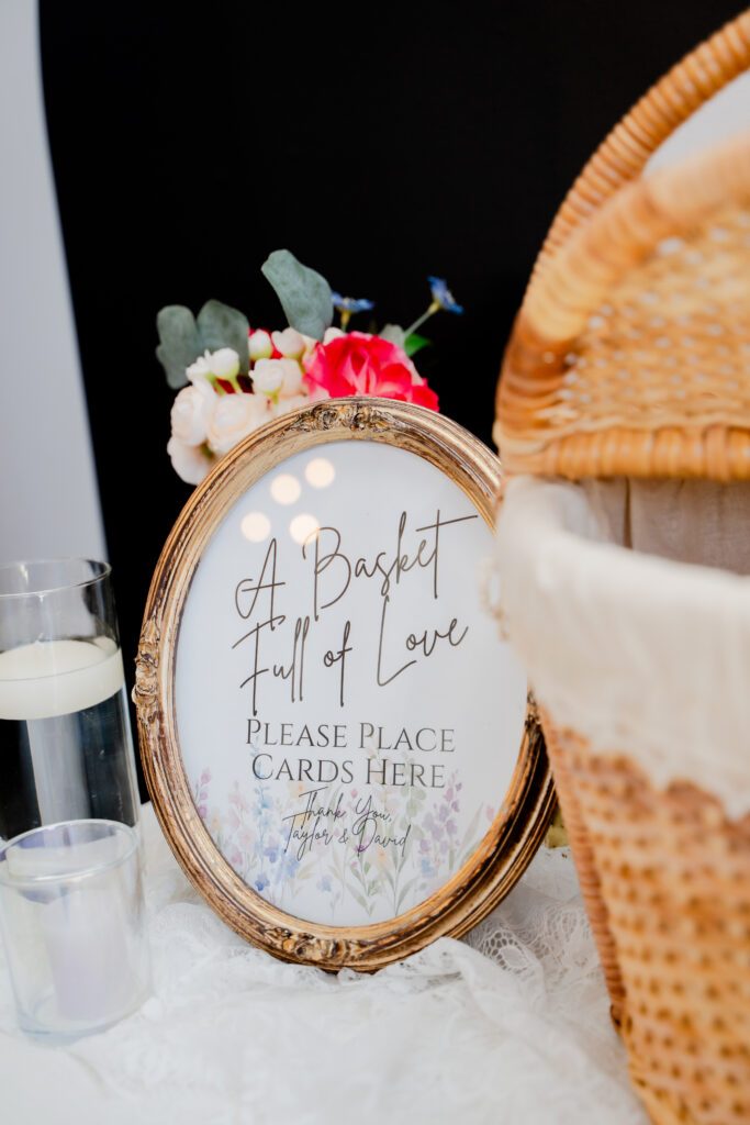 A basket of love sign to put wedding cards into a basket