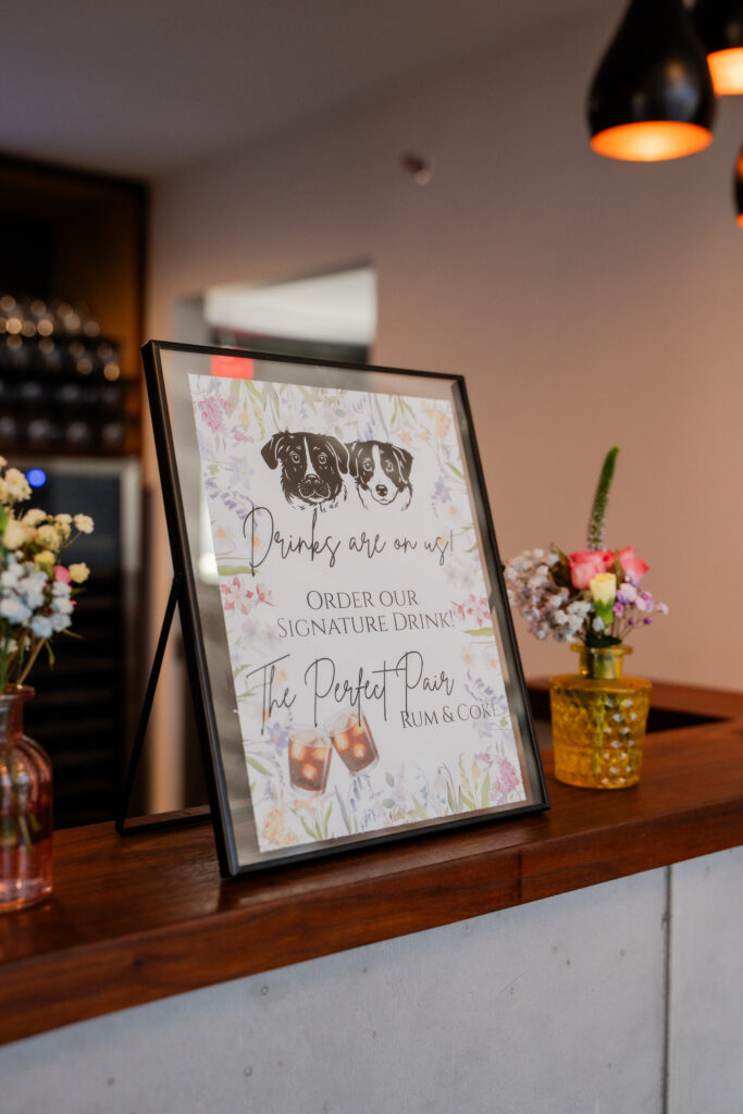 Personal cocktail sign on bar with wedding couples dogs on it with text