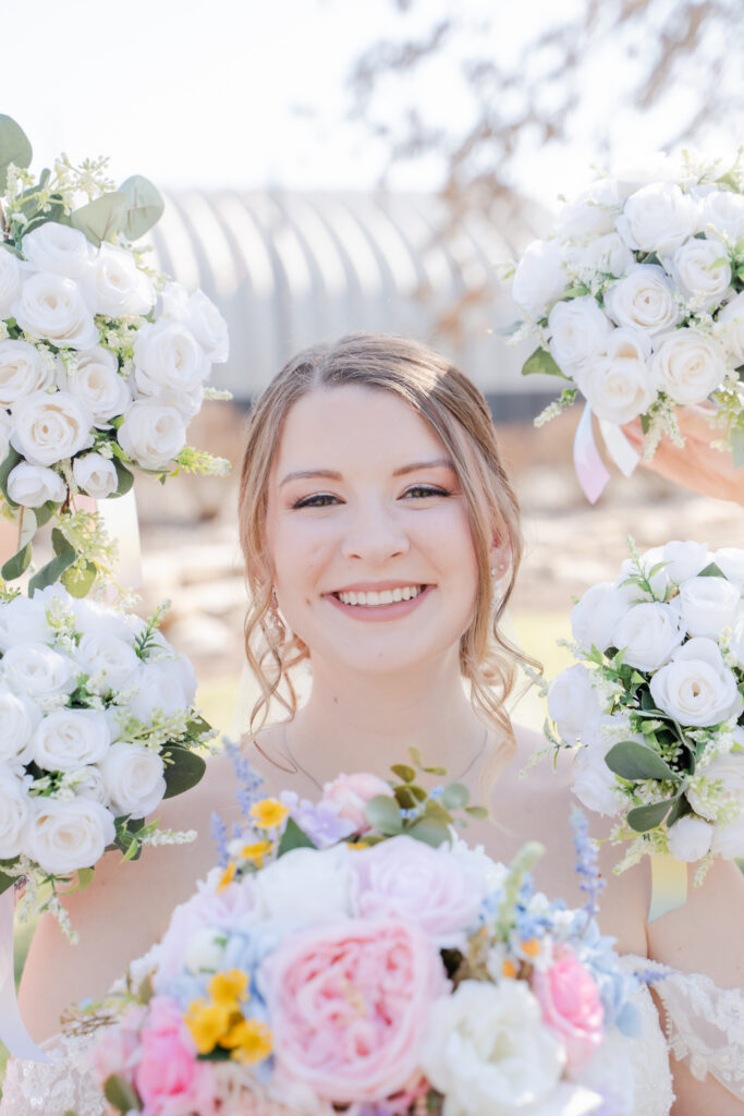 flowers around brides face wedding photo white bridesmaids bouquet