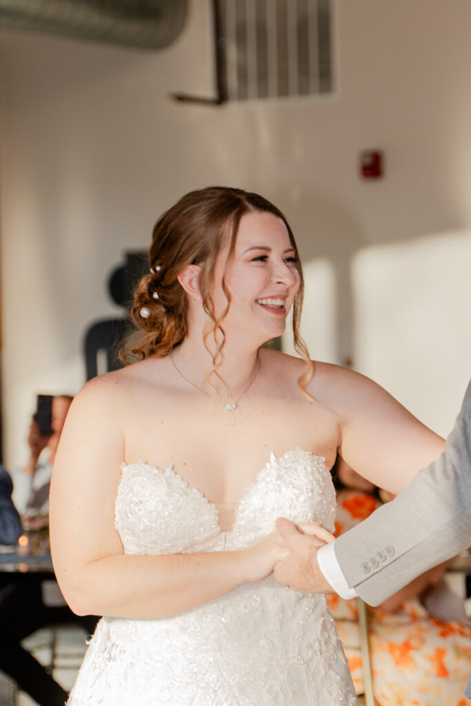 bride smiling at groom